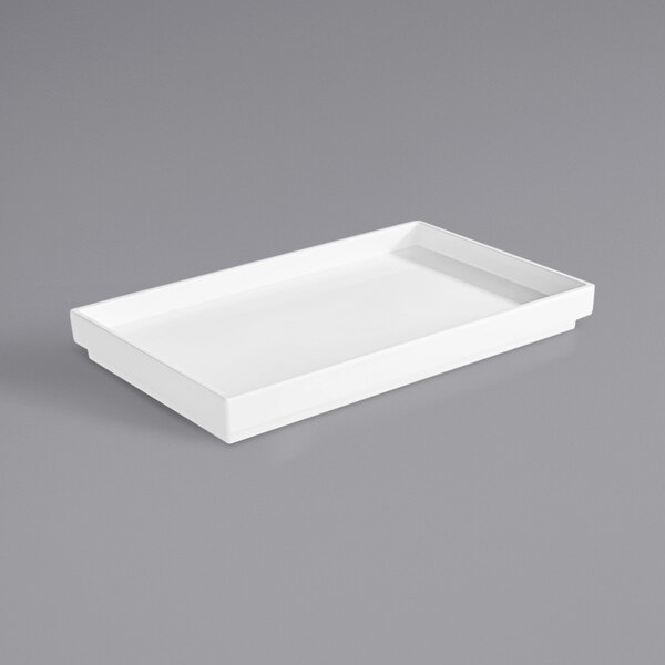 A white rectangular APS Asia Plus melamine tray.