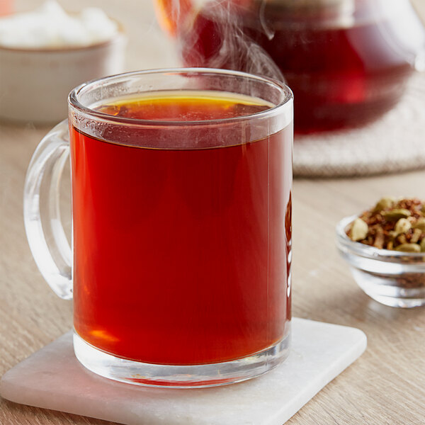 A glass mug of Davidson's Organic Licorice Chai tea.