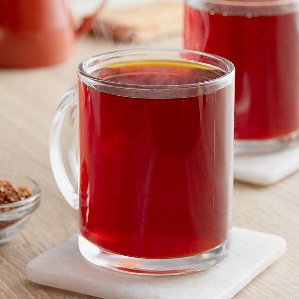 Davidson's Organic Spiced Rooibos Chai loose leaf tea in a glass mug.