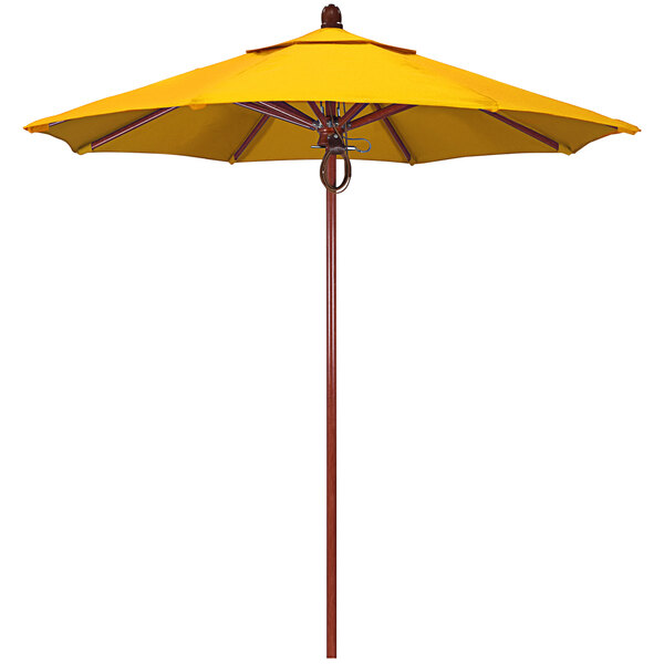 A California Umbrella yellow Sunbrella canopy on a red oak pole.