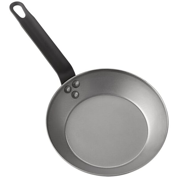 An American Metalcraft carbon steel fry pan with a handle.