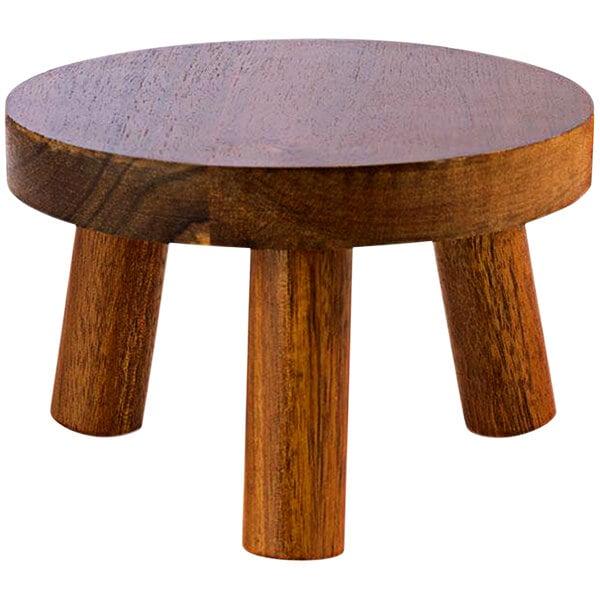 An APS Element wooden three-legged stool.