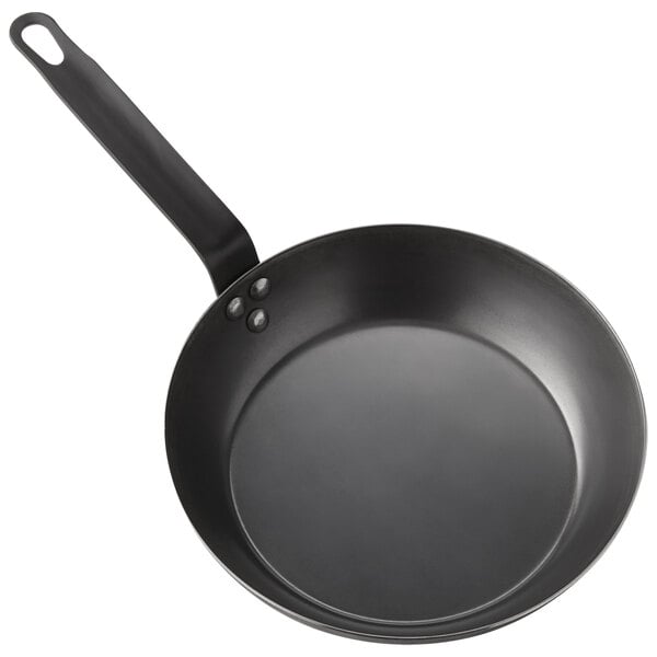 An American Metalcraft black carbon steel fry pan with a handle.