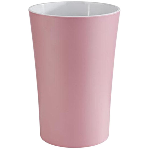A pink melamine cup with a white rim.