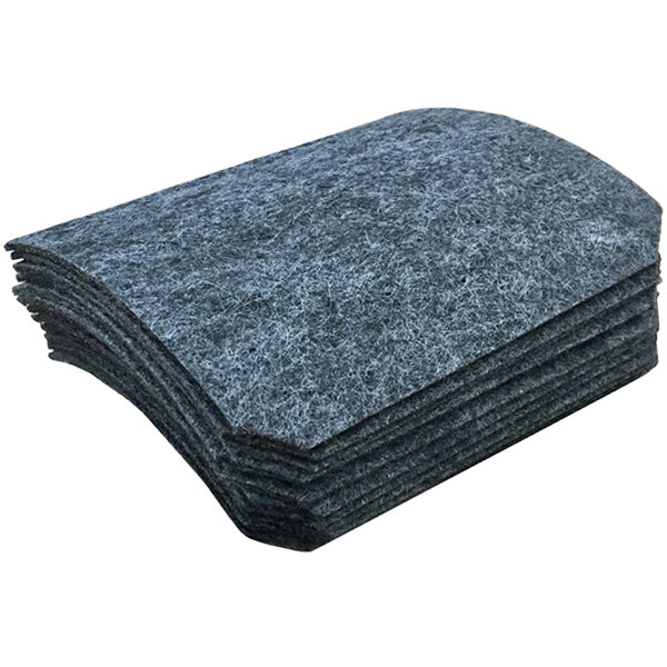 A stack of black felt pads on a table.
