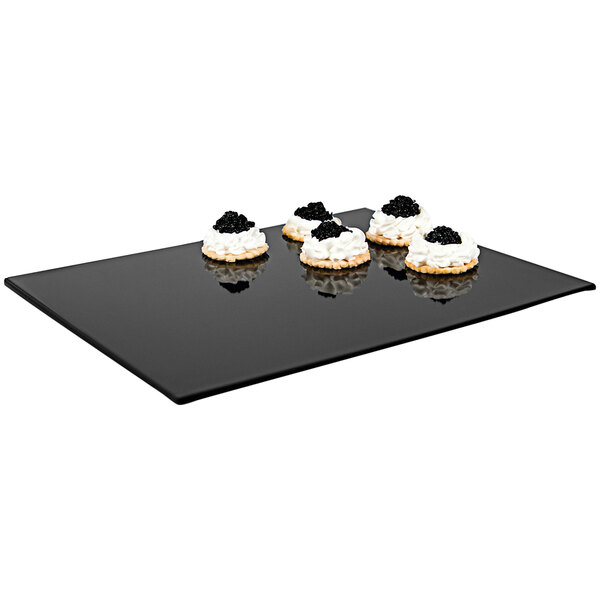A black APS Zero melamine tray with cookies on it.