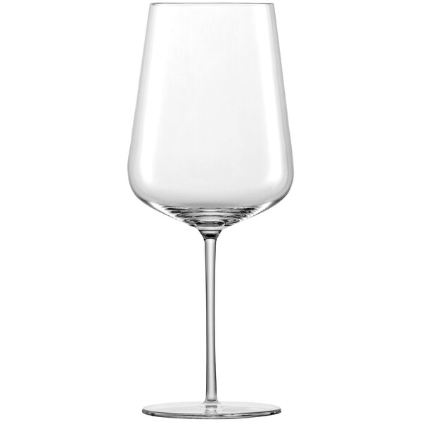 A close-up of a clear Schott Zwiesel Verbelle Bordeaux wine glass with a long stem.