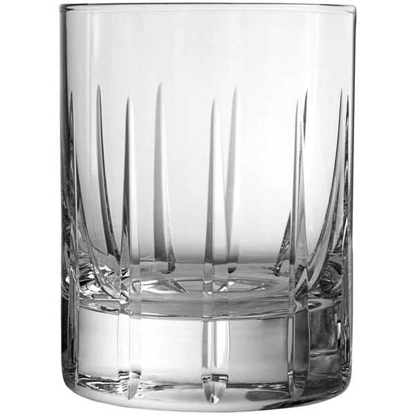 A close up of a Schott Zwiesel Distil Kirkwall Rocks glass with a curved design on the edge.