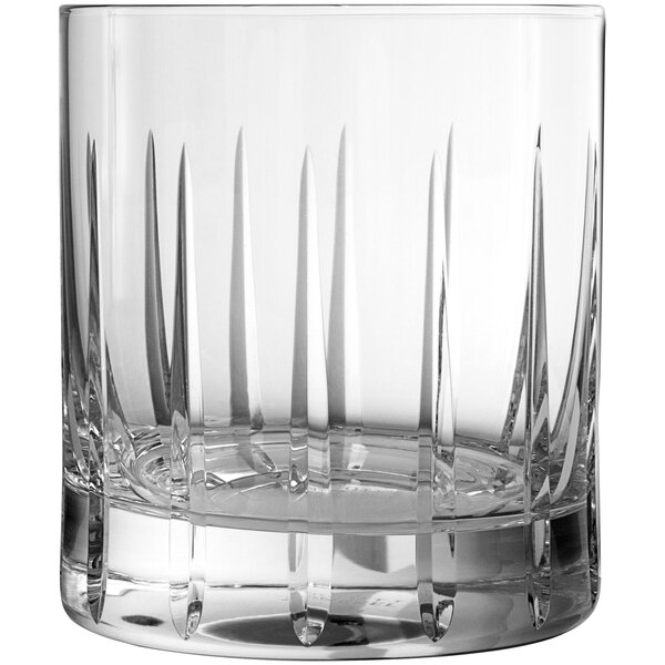 A close up of a clear Schott Zwiesel Distil Kirkwall Rocks glass with a pattern on it.