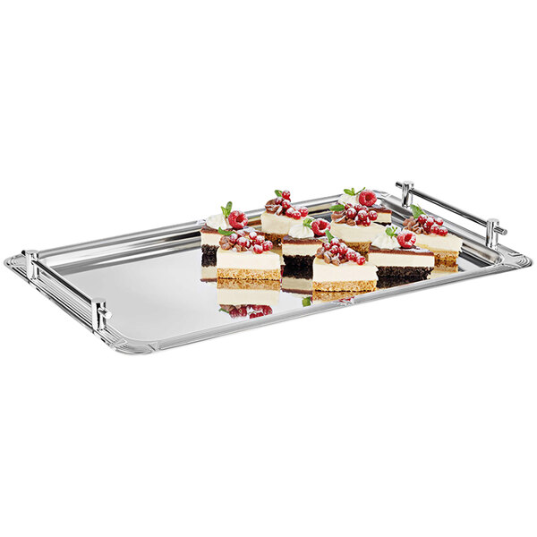 An APS Profi stainless steel tray with small desserts on it.