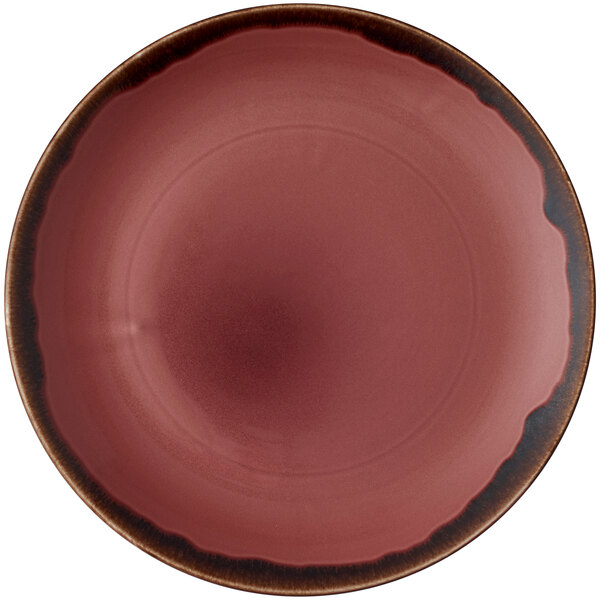 A plum china plate with a brown rim.