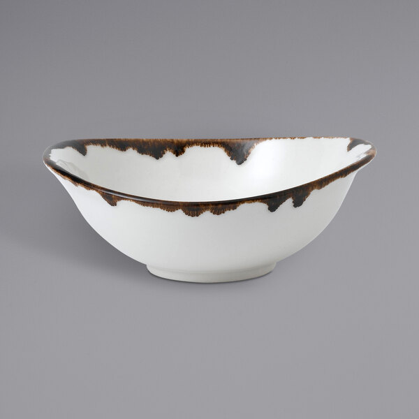 A white Dudson Harvest china bowl with brown specks.