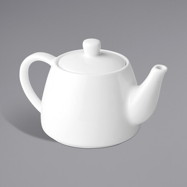 A close-up of a white Chef & Sommelier teapot with a handle.