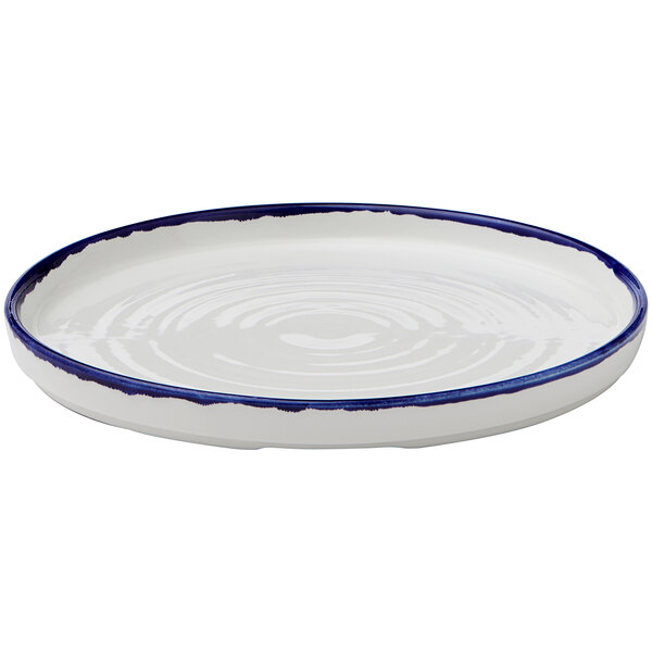 A Dudson Harvest white china plate with a blue rim.