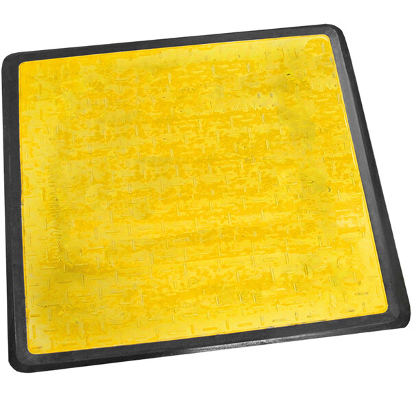 A yellow square Plasticade pedestrian trench cover with black border.
