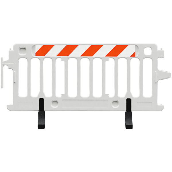A white Plasticade parade barricade with white and orange stripes.