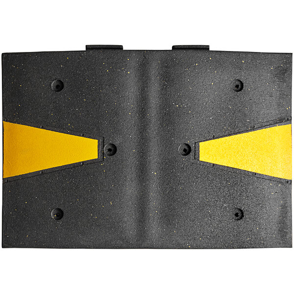 A black rectangular Plasticade speed hump with yellow reflective stripes.