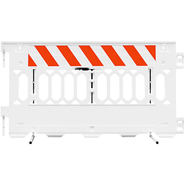 A white Plasticade parade barricade with white engineer grade striped sheeting on both sides.