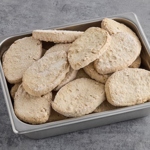 A metal tray filled with Gardein plant-based Chick'n breasts.