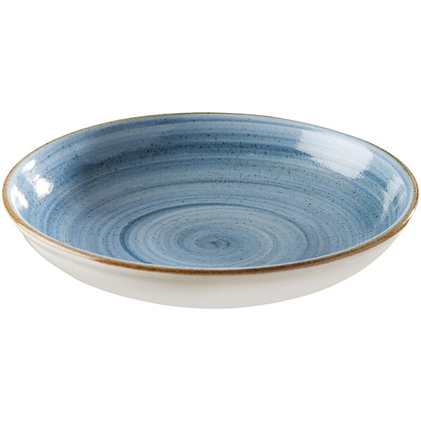 A blue and white porcelain plate with a gold rim.