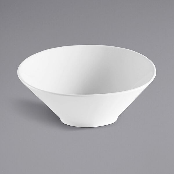 A Corona by GET Enterprises Elegance bright white porcelain bowl on a gray surface.