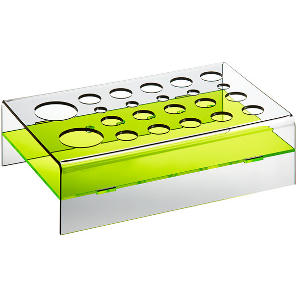 A clear and green plastic tray with holes in it.