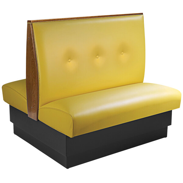 An American Tables & Seating yellow double booth with a black tufted back and end caps.