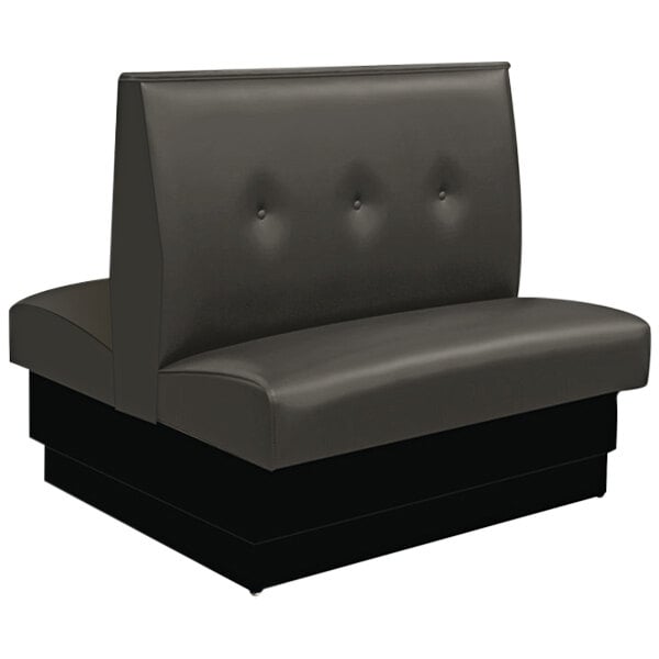 An American Tables & Seating black upholstered double booth with button tufting on the back.