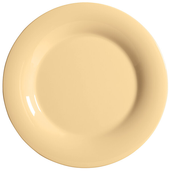 A white melamine plate with a yellow rim.