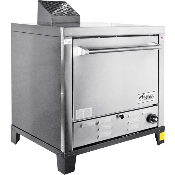 A stainless steel Peerless countertop pizza oven with a metal top.