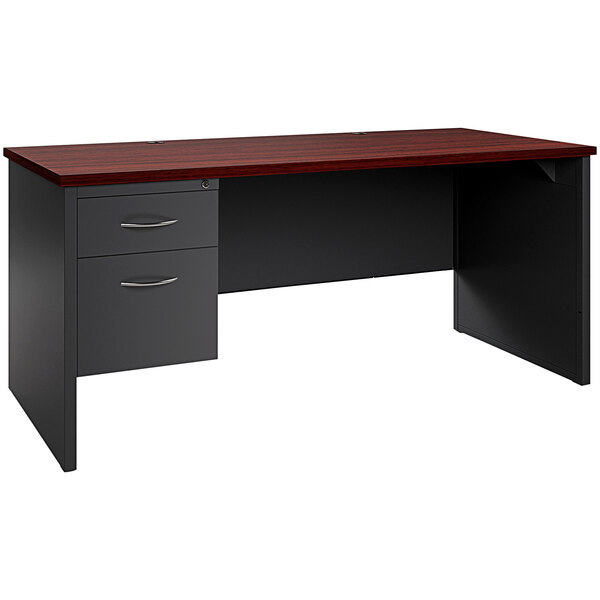 A charcoal Hirsh Industries desk with a mahogany wood top and left-hand pedestal with two drawers.