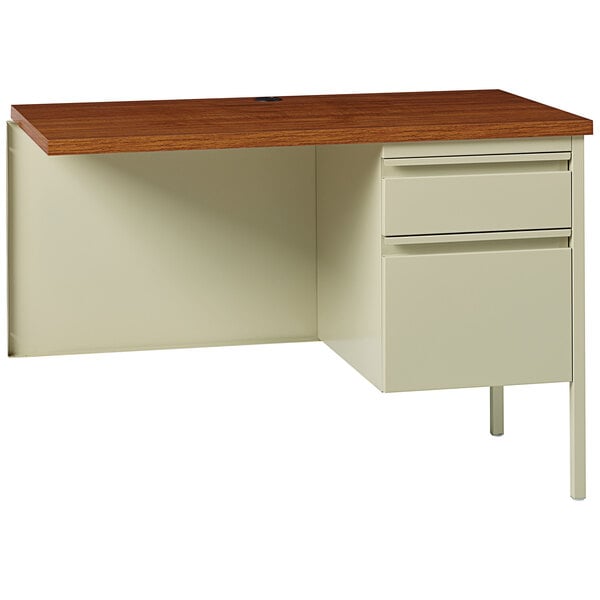 A Hirsh Industries putty and oak return with drawers on a wooden top.