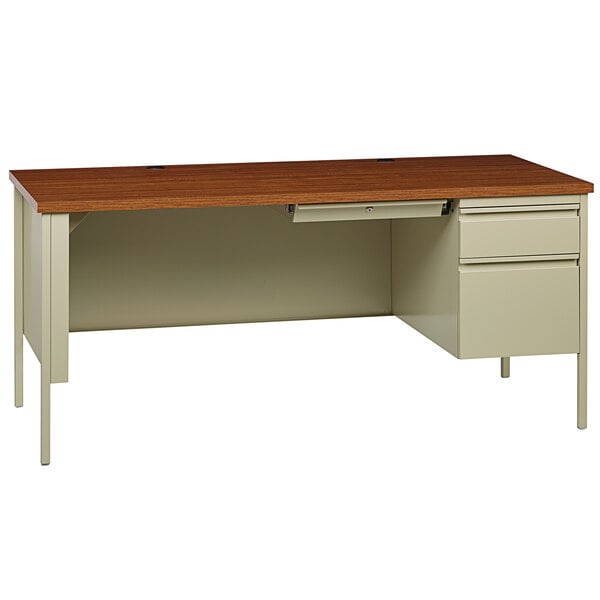 A Hirsh Industries office desk with a center drawer and right-hand pedestal.