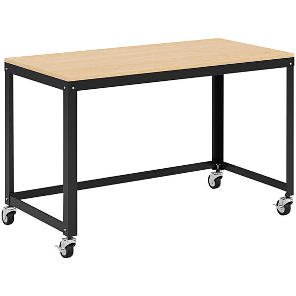 A Hirsh Industries black and maple metal desk with wheels.