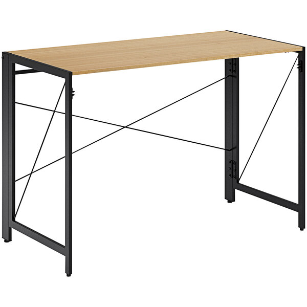 A black and teak Hirsh Industries folding office desk with metal legs.