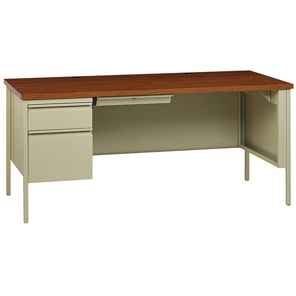 A Hirsh Industries putty and oak office desk with drawers and a left-hand pedestal.
