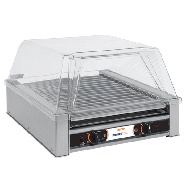A Nemco narrow hot dog roller grill with a clear cover.