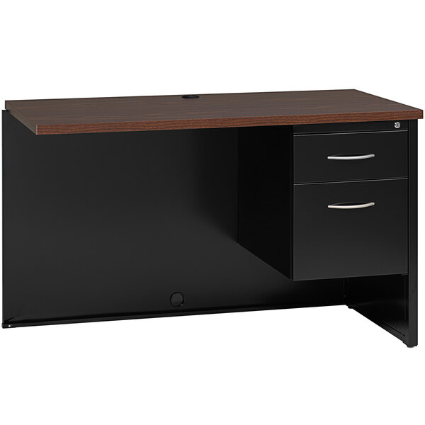A black and brown desk return with drawers.