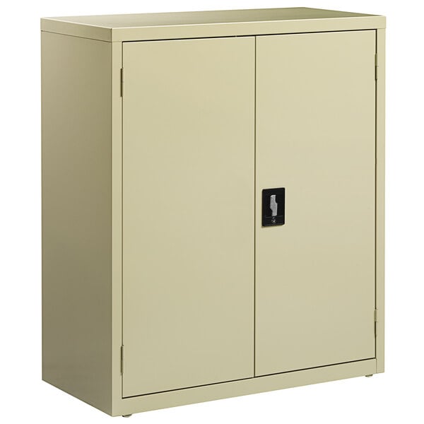 A tan metal storage cabinet with two doors and a black handle.