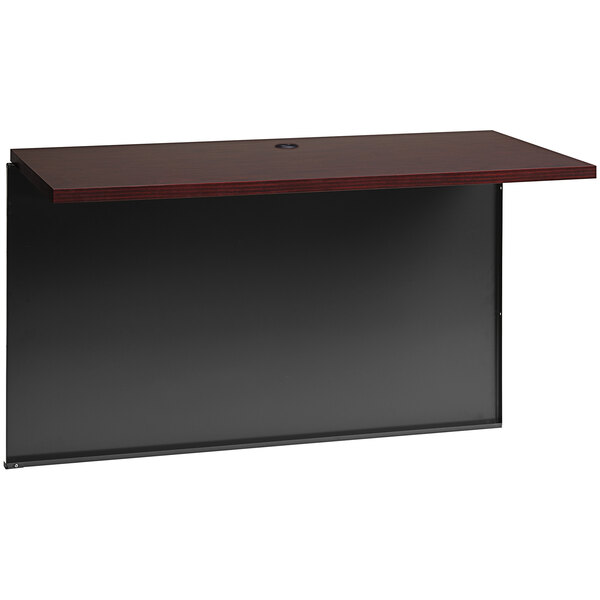 A black desk with a mahogany top and shelf.