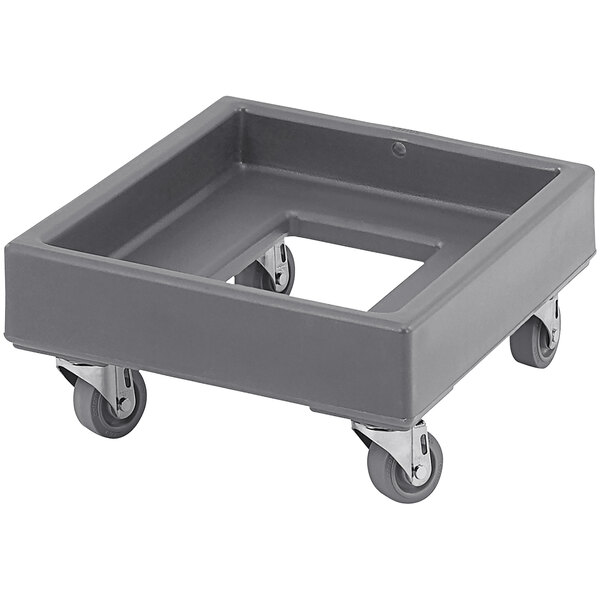 A granite gray plastic dolly with wheels for a Cambro milk crate.