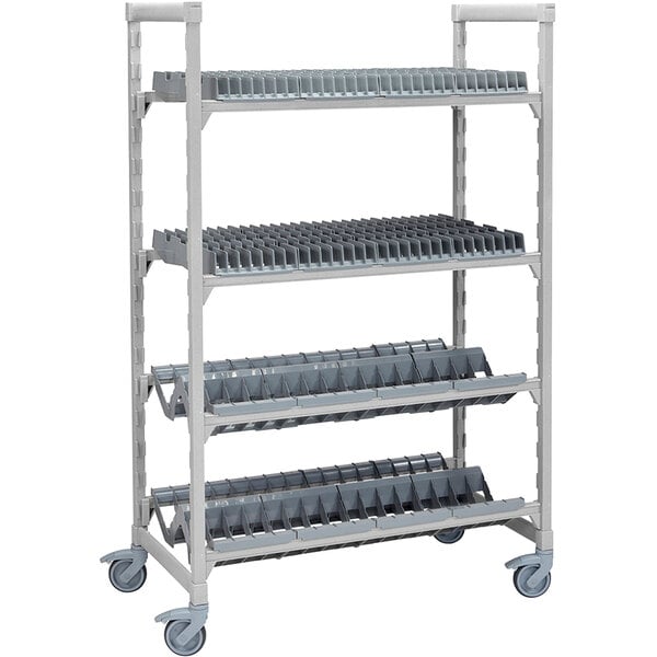 A grey metal Cambro Camshelving drying rack with 2 vertical and 2 angled shelves.