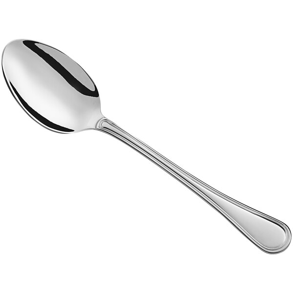 A Libbey Louvre stainless steel serving spoon with a silver handle and spoon.