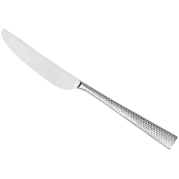 A silver Reserve by Libbey stainless steel dinner knife with a textured handle.