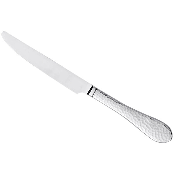 A silver Reserve by Libbey dinner knife with a textured handle.