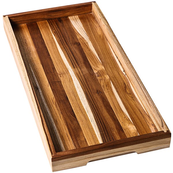 A Teakhaus teakwood serving tray with hand grips.