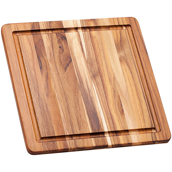 A Teakhaus edge grain teakwood cutting board with a square shape.