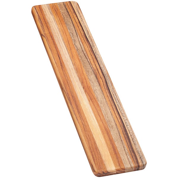 A Teakhaus lightweight rectangular teakwood bread board with a long handle.