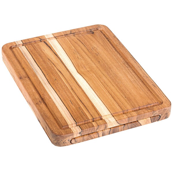 A Teakwood cutting board with hand grips.
