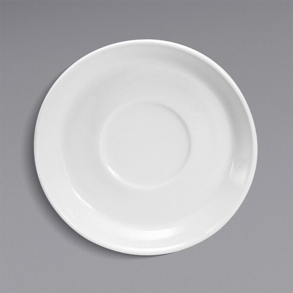 A Oneida Classic cream white porcelain saucer with a circular edge on a white surface.